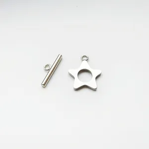 Close-up detail shot of stainless steel star OT clasp toggle components for DIY jewelry.