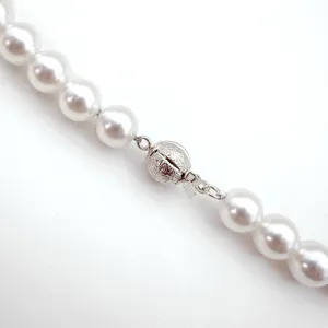 Matte spherical pearl necklace clasp DIY jewelry accessory with sparkling texture detail.