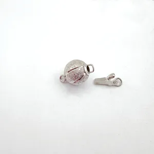 Detailed view of a silver matte spherical flash sand clasp for DIY jewelry making.