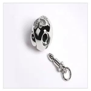 Close-up detail of a silver spherical rhinestone bayonet clasp, ideal for DIY jewelry making parts.