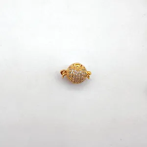 Close up of gold plated spherical rhinestone ball clasp detail, perfect for DIY jewelry.