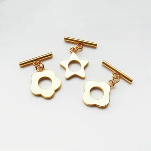 Close up of gold stainless steel DIY flower and star shape toggle clasp accessories.