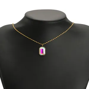 Golden stainless steel necklace featuring a rectangular iridescent crystal gemstone pendant