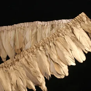 Gold goose feather fringe trim ribbon for DIY clothing accessories, crafts, and home decor projects.