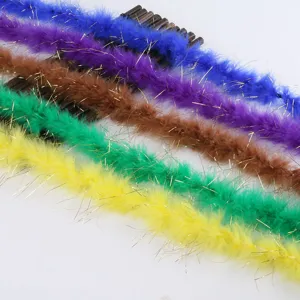 Detailed close-up view of colorful feather boas with gold tinsel for crafts and decor.