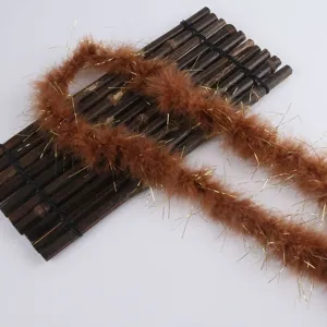 Close-up detail of fluffy brown feather tinsel strip, ideal for craft and floral design.