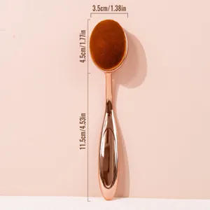 Rose gold oval makeup brush for liquid foundation, smooth blending makeup tool details.