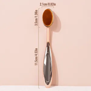 Rose gold oval makeup brush detail view showing head width and handle length dimensions.