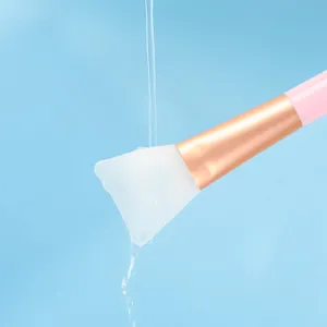 Silicone face mask brush with soft head and pink handle for applying mud masks and facial SPA.