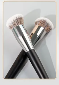 Detailed shot of angled foundation makeup brushes featuring soft bristles and sleek design.