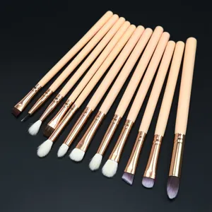 Close-up detail of 12-piece eye makeup brush set with soft bristles and elegant handles.
