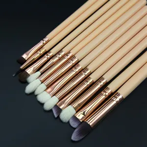 Detailed shot of 12-piece eye makeup brush set with soft bristles and wooden handles.