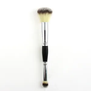 Double-ended makeup brush detail view showing dual brush heads, soft bristles and handle.