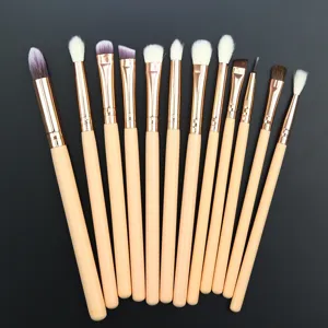 12-piece professional eye makeup brush set with wooden handles for eyeshadow and blending.