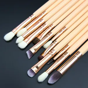 Professional 12-piece makeup brush set with soft bristles and rose gold handles for eye shadow.