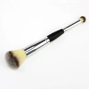 Dual ended makeup brush detail shot showing fluffy blush brush and precise contour tip bristles.