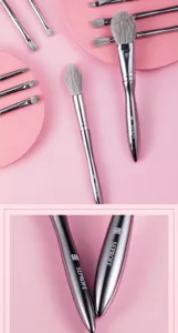 Professional 13-piece makeup brush set with silver metal handles and soft grey bristles.
