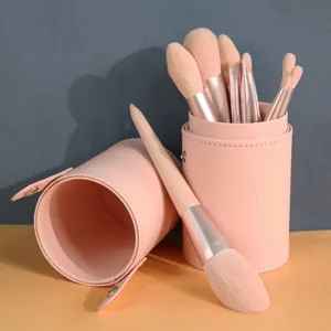 Pink makeup brush set with cute PU leather holder, professional cosmetic tools for daily use.