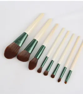 Makeup brush set detail, soft bristle cosmetic tools, wooden handle eye shadow brush close up.