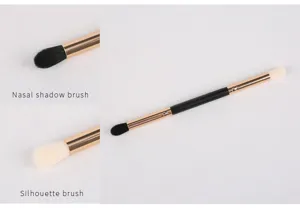 Pinceau de maquillage double embout à poils doux, idéal pour ombrer et sculpter le visage.