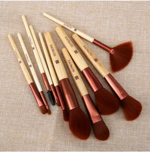 10-piece makeup brush set with bamboo handles and soft bristles for face beauty application.