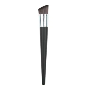 Angled foundation brush for liquid makeup, smooth application and flawless cosmetic finish.