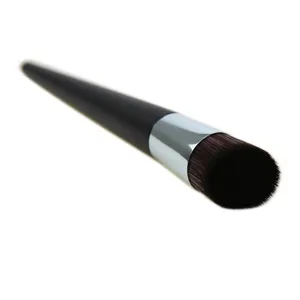Slant foundation brush with dense dark bristles and black handle for smooth makeup finish.