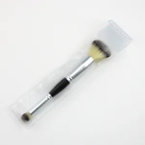 Detail view of double-ended makeup brush with soft bristles and metal handle for easy contouring.