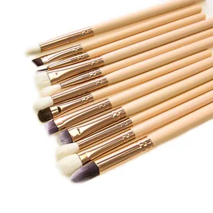 12-piece eye makeup brush set with wooden handles and rose gold ferrules for professional blending.