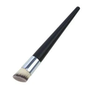Close-up detail of the angled foundation brush with soft bristles and sleek handle.