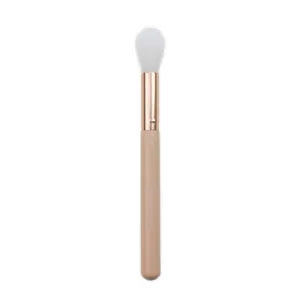 Detail shot of the tapered highlighter makeup brush with soft bristles and rose gold ferrule.