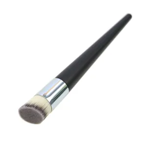 Angled foundation brush for liquid makeup and smooth blending, professional cosmetic beauty tool.