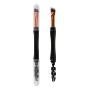 Pinceau à sourcils double embout avec goupillon et capuchon de protection transparent.