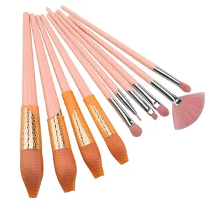 Detailed view of pink makeup brush bristles and protective mesh covers, soft and neat tool.