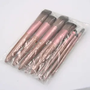 Detailed view of the 12-piece makeup brush set with rose gold handles and soft bristles.
