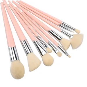 Professional 10-piece makeup brush set with elegant pink handles and soft synthetic bristles.