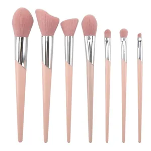 Professional 7-piece pink makeup brush set with soft bristles for face, powder, and eyeshadow.