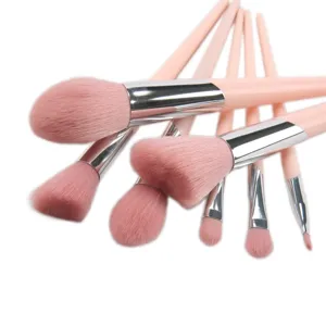 Pink makeup brush set with soft bristles for powder and eyeshadow application details.