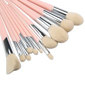 Professional pink makeup brush set with soft bristles, ideal for powder and eyeshadow.