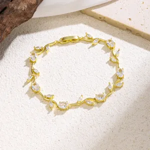 Elegant gold-plated vine leaf cubic zirconia bracelet, chic fashion wrist jewelry for women.
