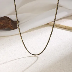Elegant black crystal rhinestone gold claw chain necklace detail shot fashion accessory