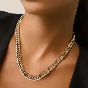 Close-up detail of the luxury gold-plated titanium steel cuban chain necklace for men.