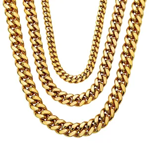 Detailed close-up of multiple gold-colored stainless steel Cuban link chains in layered design.