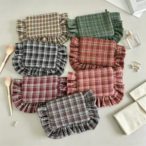 Retro plaid ruffled cosmetic bag, stylish women's clutch and portable makeup storage pouch.