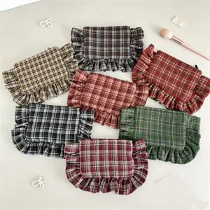 Vintage plaid cosmetic bag with ruffles, stylish women's makeup pouch and portable storage bag.