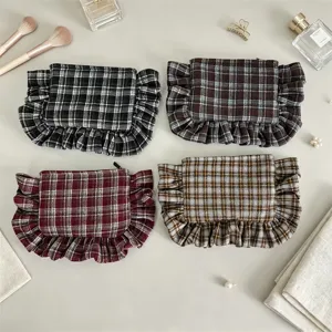 Vintage plaid ruffle cosmetic bag detail, chic women portable storage pouch and makeup organizer.