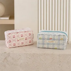 Cute quilted cosmetic bag with lace trim cherry bow print storage pouch for daily makeup essentials.