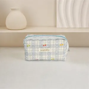 Cute blue plaid lace cosmetic bag with cherry bow print, stylish portable storage pouch.