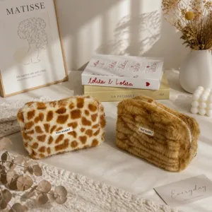 Cute plush cosmetic pouch and pencil bag with soft fuzzy fabric and stylish pattern design.