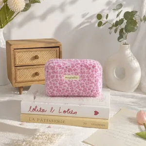 Pink leopard print plush cosmetic bag detail, soft furry makeup pouch for daily storage.